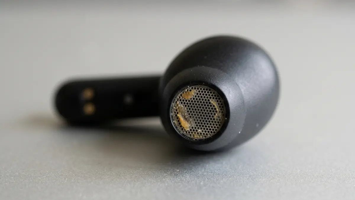 Earbuds clogged with earwax showing why earbuds sound worse over time